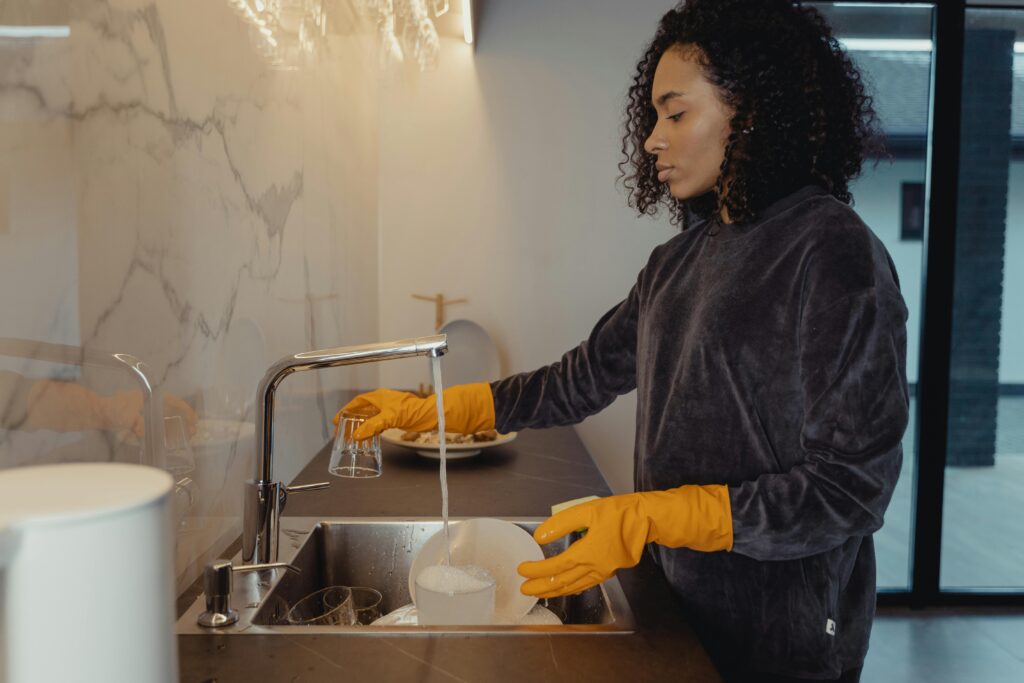 Wash up efficiently by doing dishes in one go instead of multiple sessions.